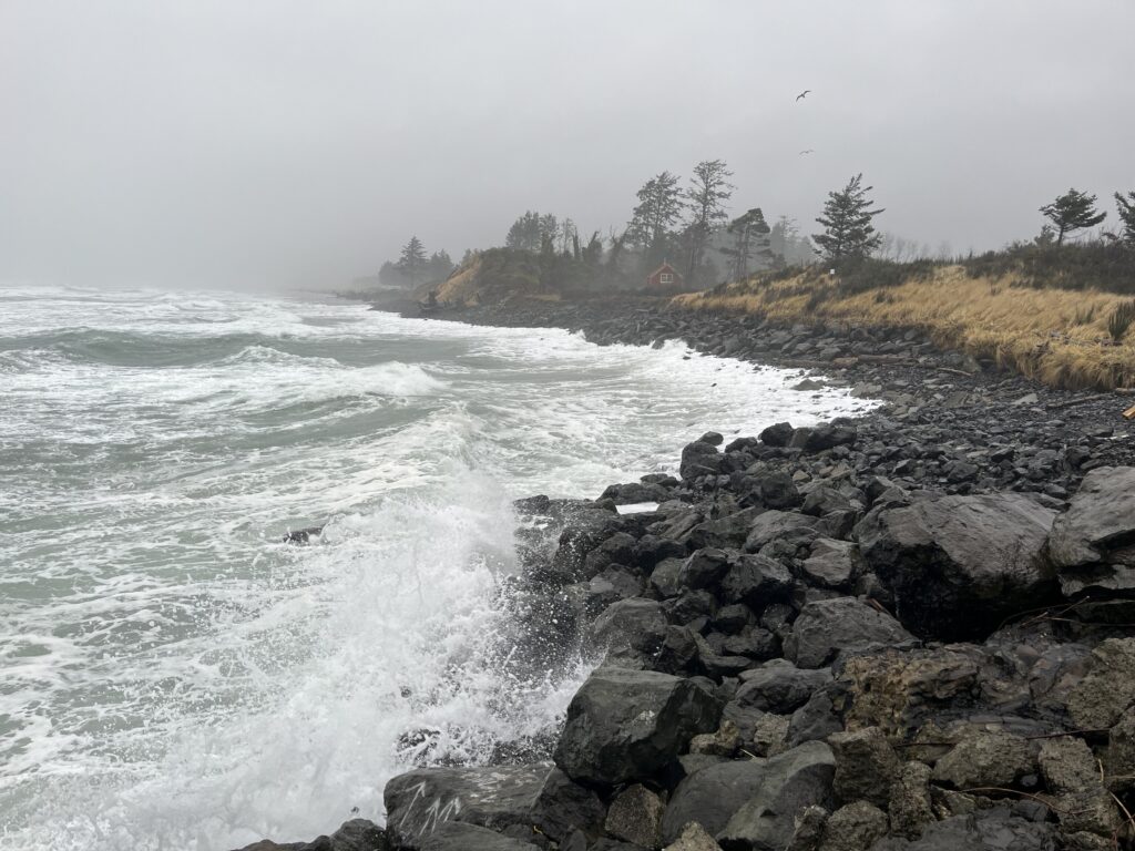 a rocky beach with waves crashing (MyCoast AI)