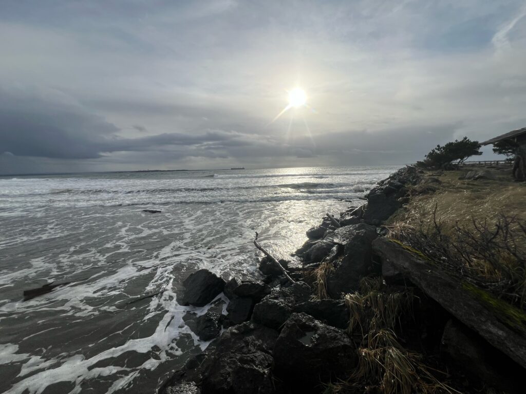 a rocky beach with the sun shining (MyCoast AI)