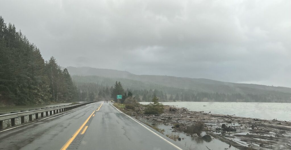 a road with a body of water on the side (MyCoast AI)