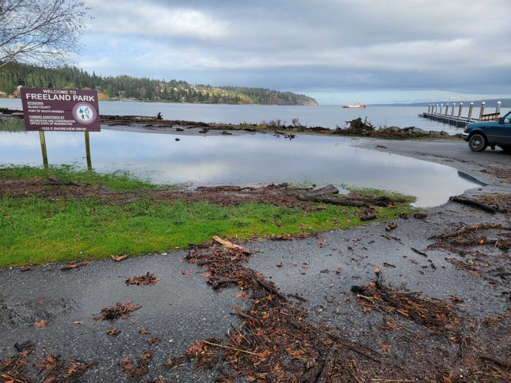 a sign next to a body of water (MyCoast AI)