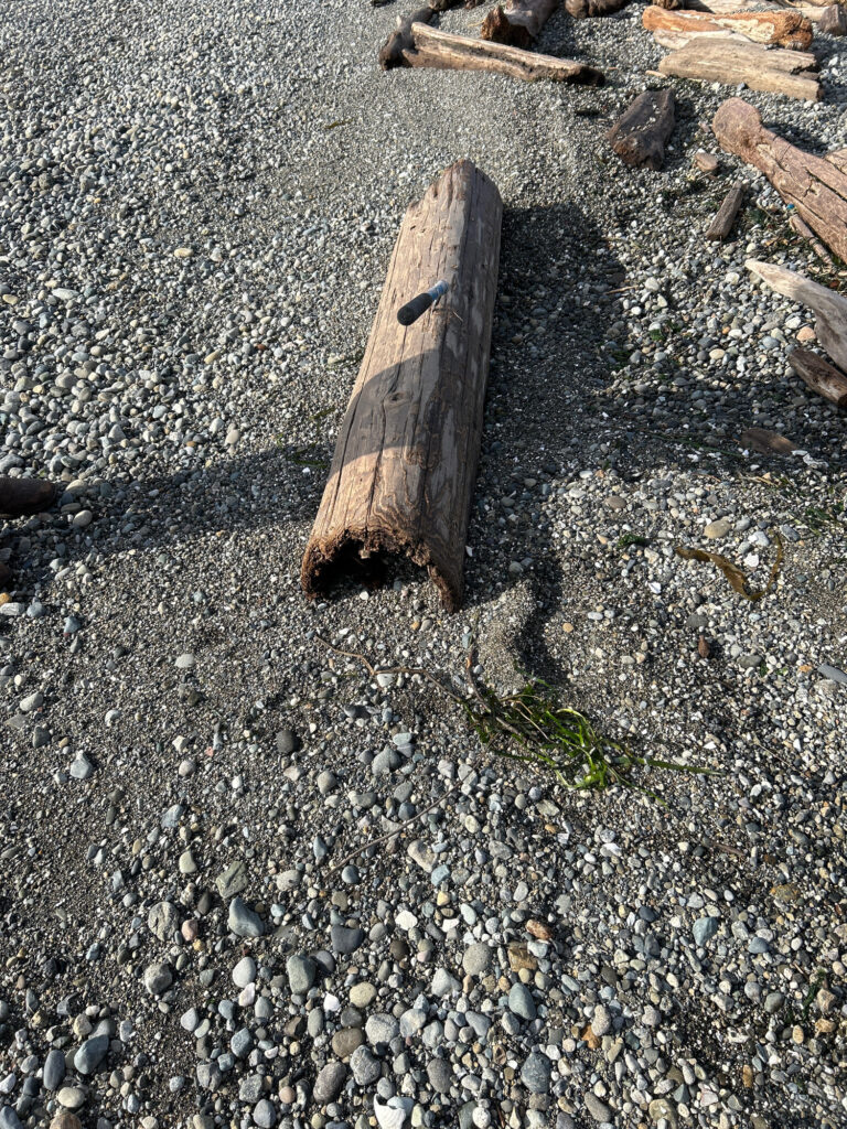 a wooden cross on a rocky surface (MyCoast AI)