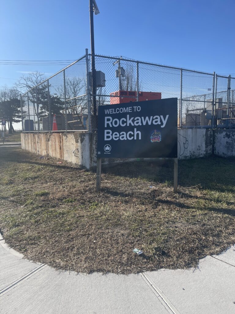 a sign on a fence (MyCoast AI)