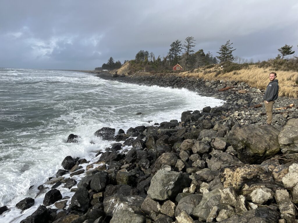 a person standing on a rocky shore (MyCoast AI)