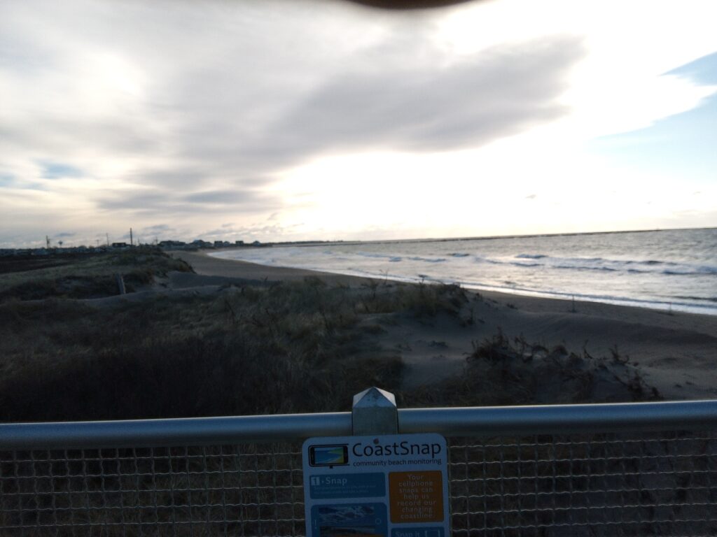 a beach with a sign (MyCoast AI)