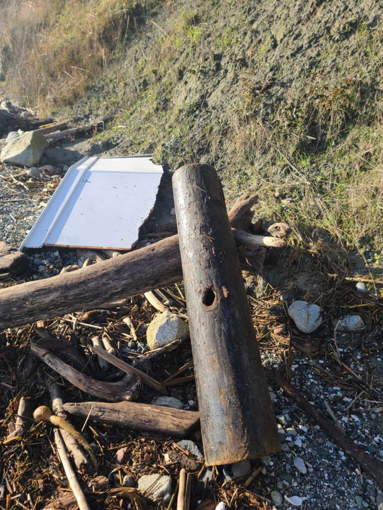 a wooden cross on a log (MyCoast AI)