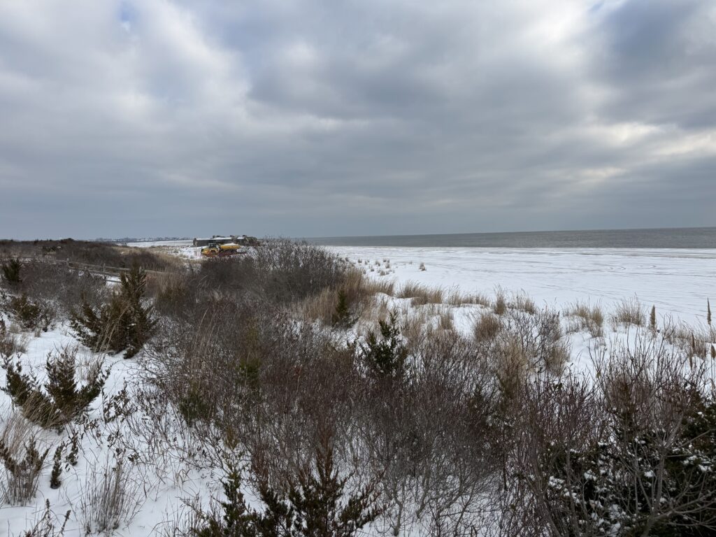 a snowy field with a house in the distance (MyCoast AI)