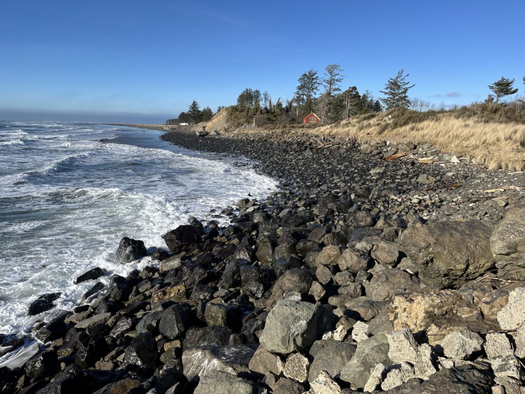 a rocky beach with waves crashing (MyCoast AI)