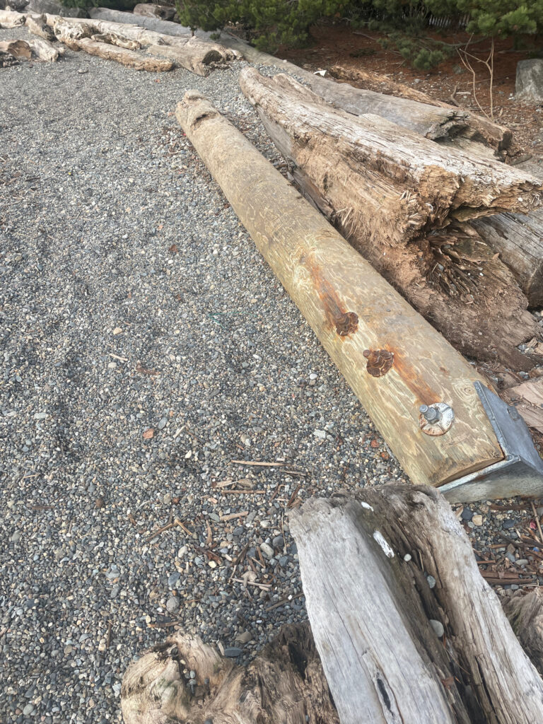 a wooden bench on a gravel road (MyCoast AI)