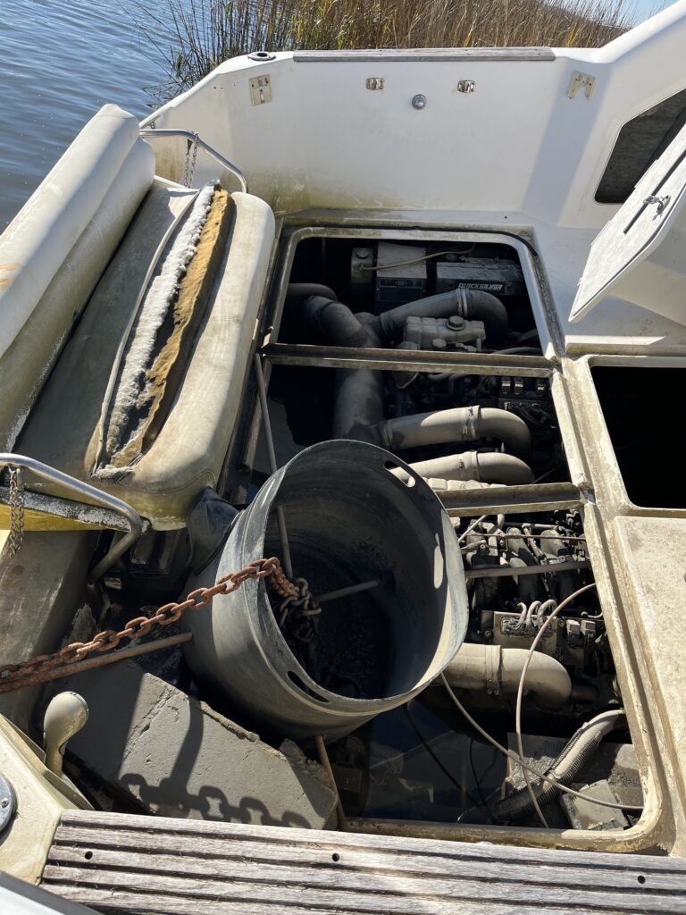 a car with the hood open (MyCoast AI)