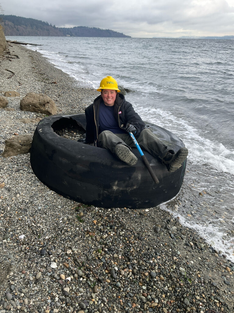 a man in a boat on a rocky shore (MyCoast AI)