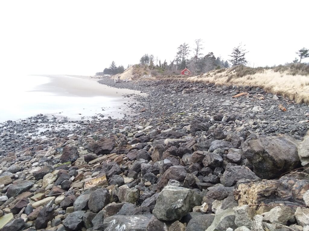 a rocky area with a body of water in the background (MyCoast AI)