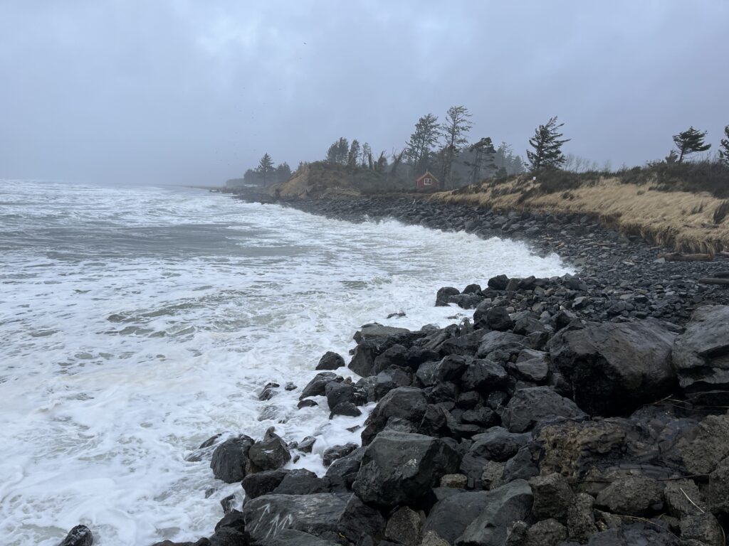 a rocky beach with waves crashing (MyCoast AI)