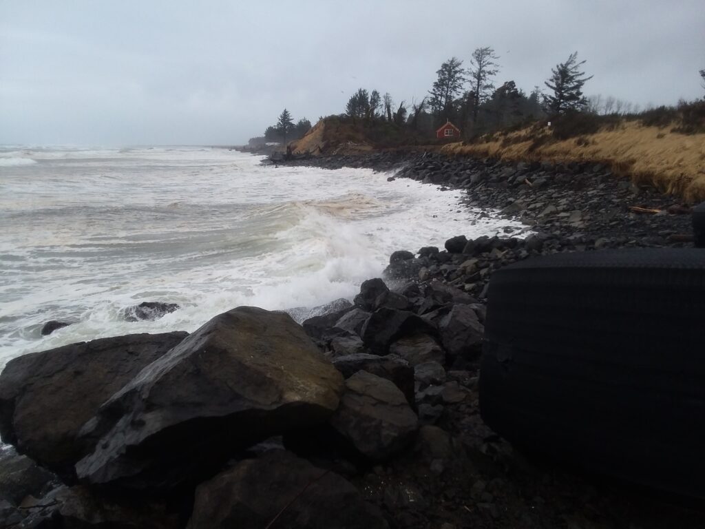 a rocky beach with waves crashing (MyCoast AI)