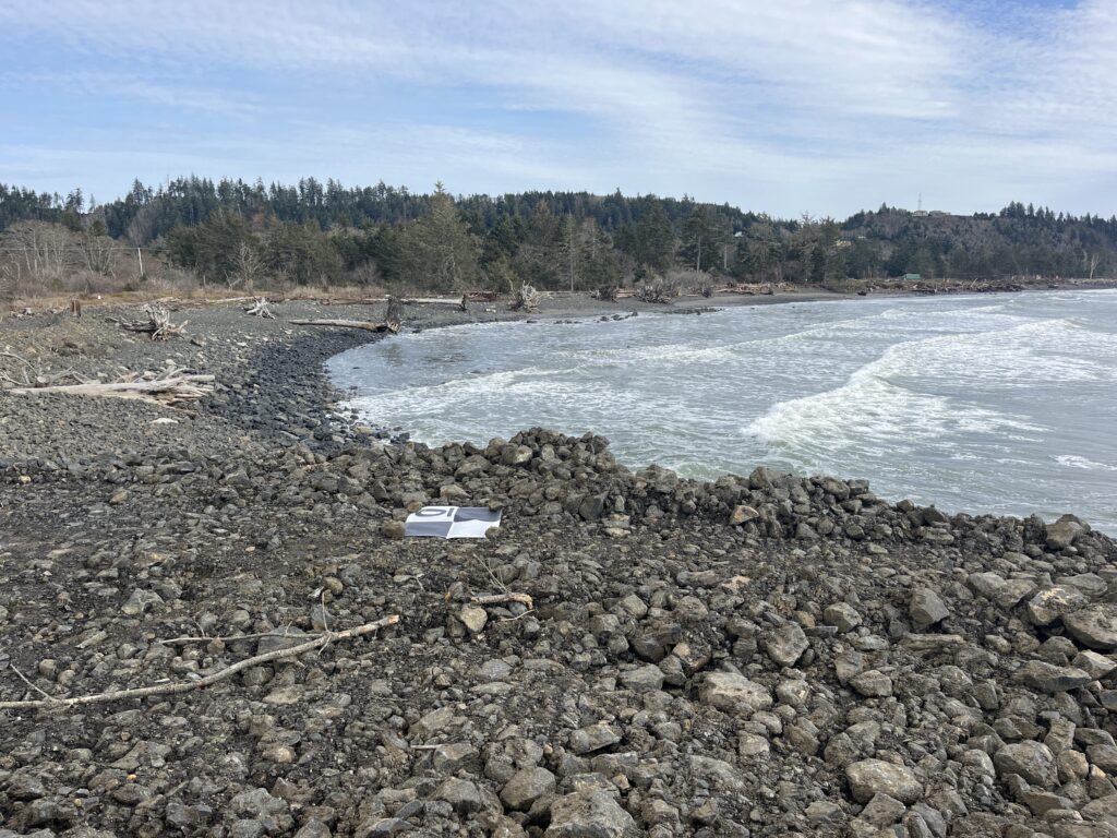 a rocky beach with a small boat (MyCoast AI)