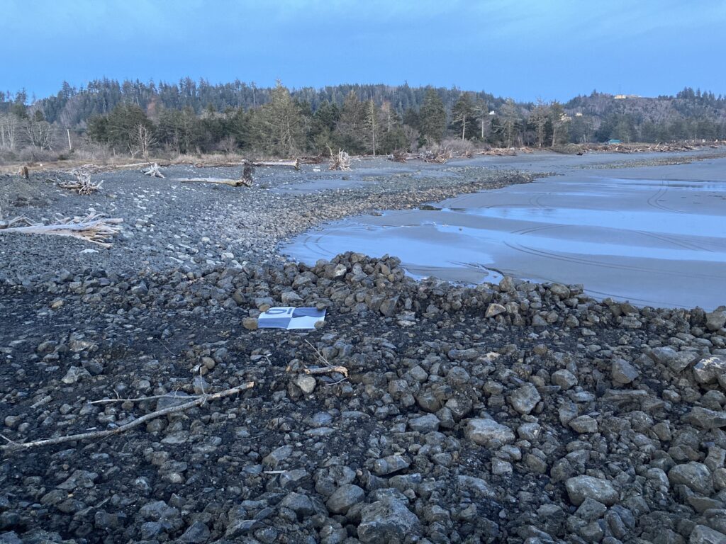 a rocky beach with a bench (MyCoast AI)