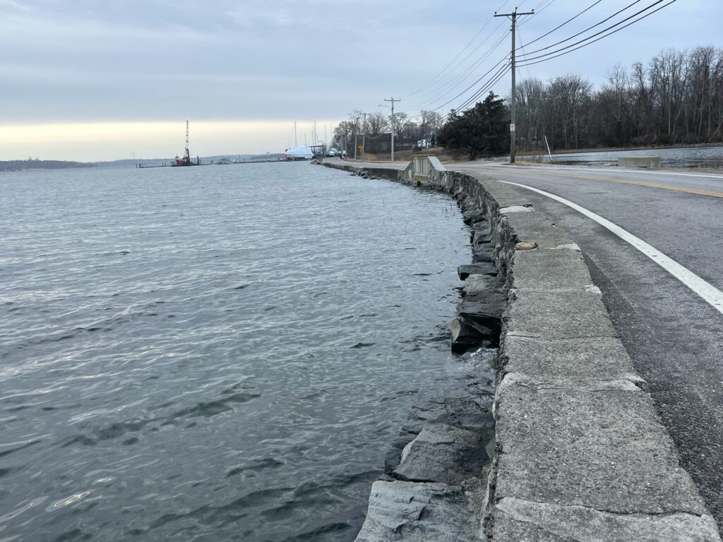 a road next to a body of water (MyCoast AI)