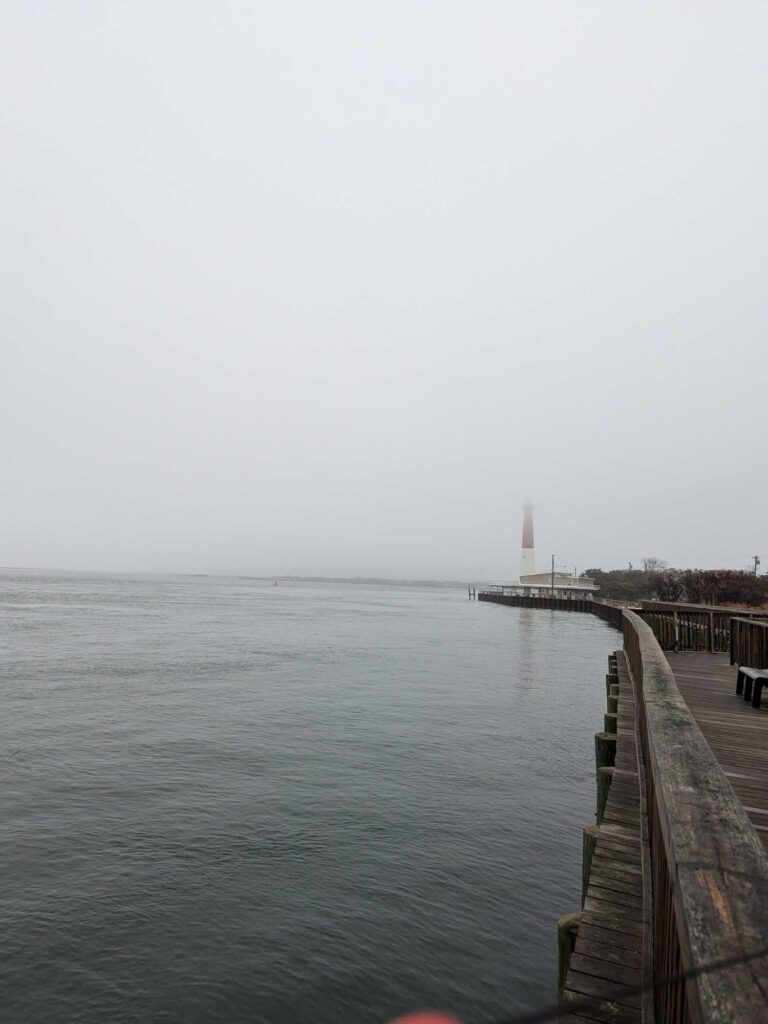 a dock leading to a lighthouse (MyCoast AI)