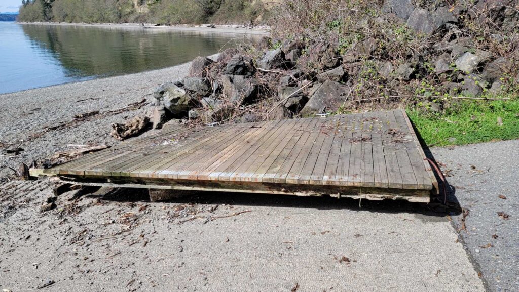 a wooden dock on a beach (MyCoast AI)