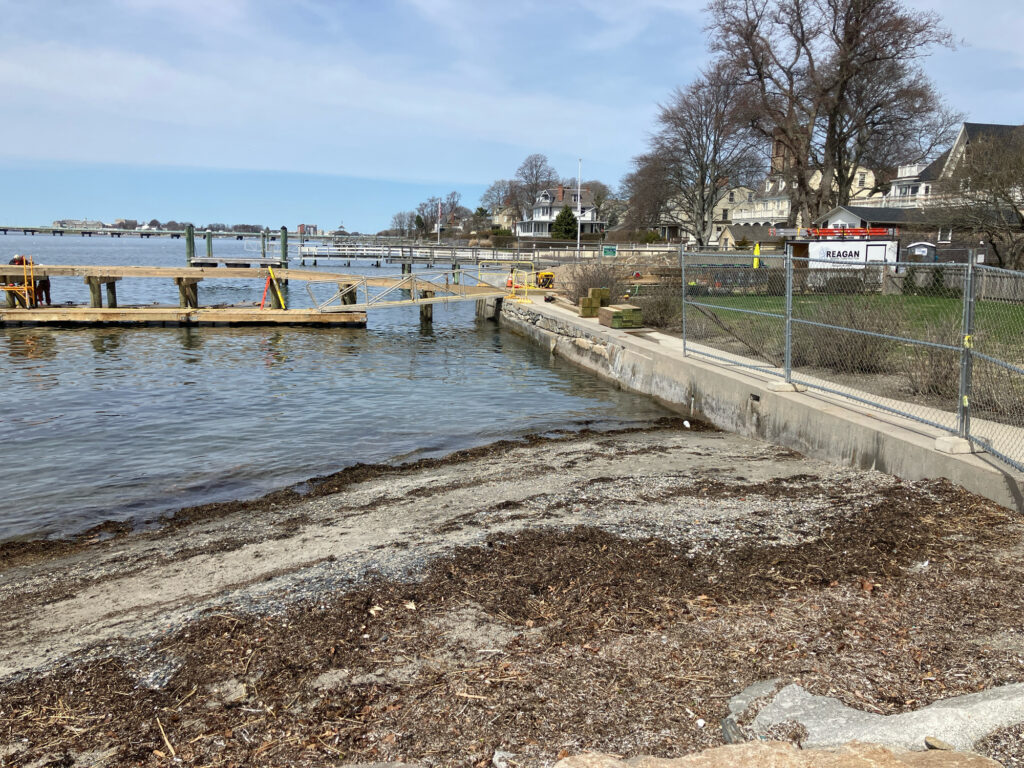 a body of water with a fence and a road by it (MyCoast AI)