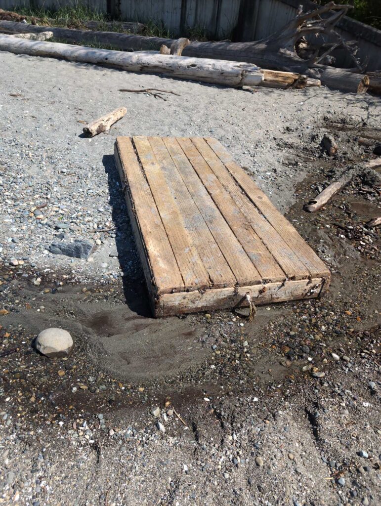 a wooden box on the ground (MyCoast AI)