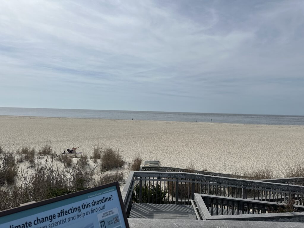 a sign on a beach (MyCoast AI)