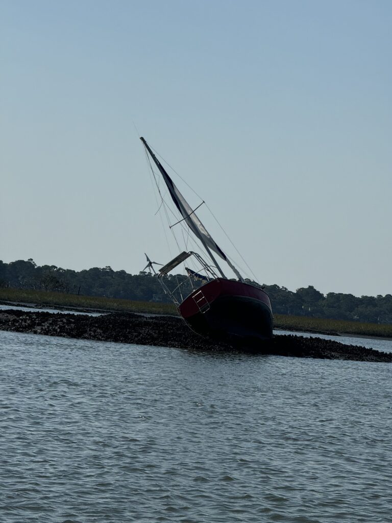 a sailboat on a small island (MyCoast AI)