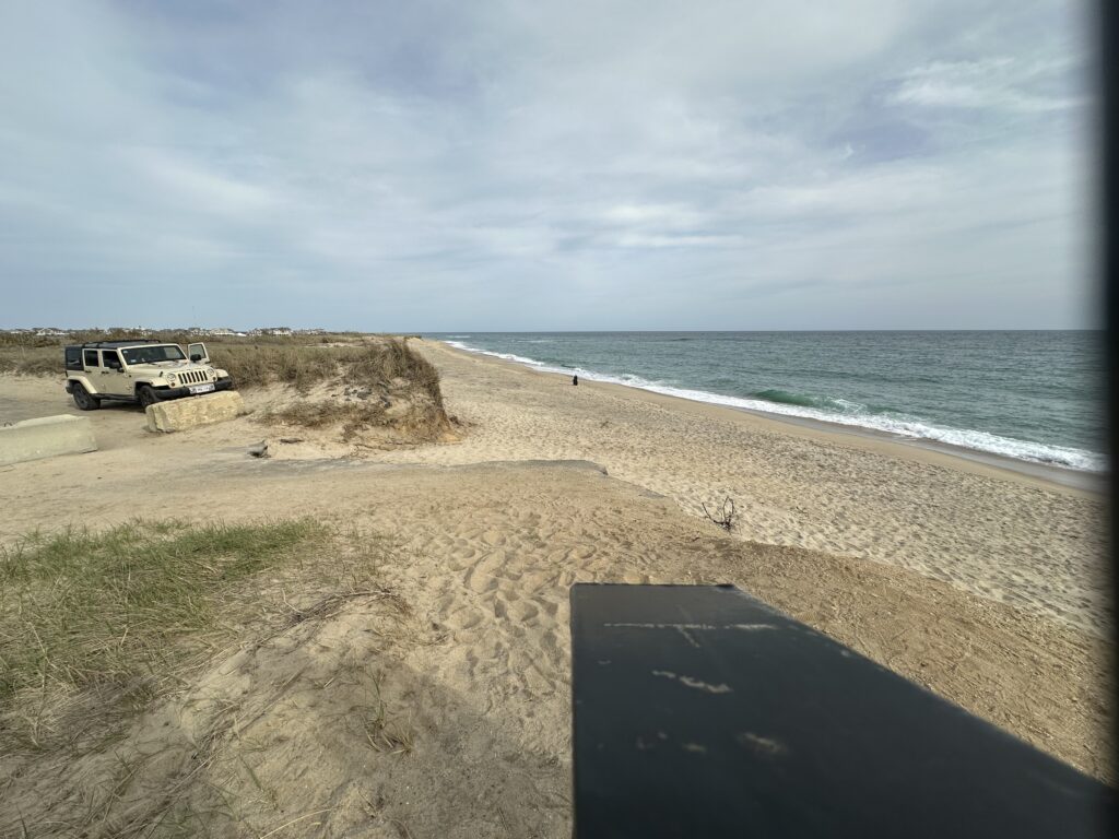 a van parked on a beach (MyCoast AI)