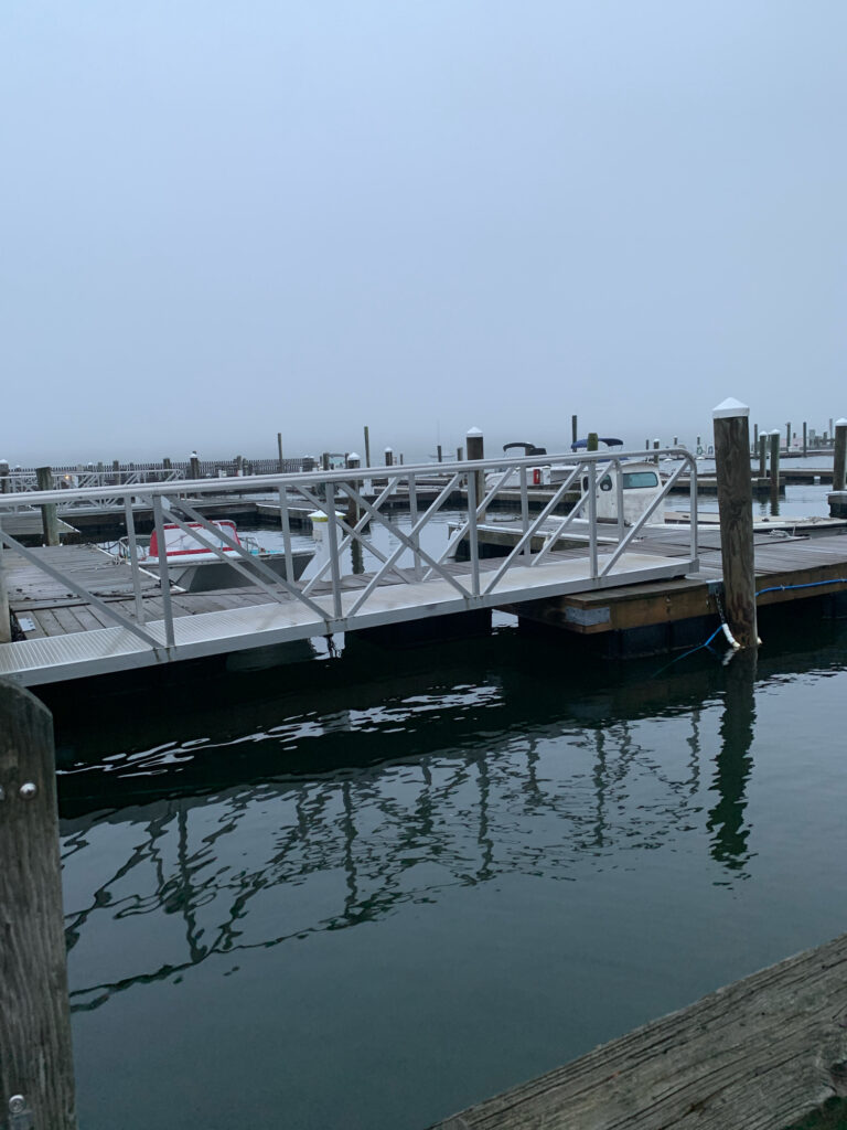 a dock with a boat in the water (MyCoast AI)