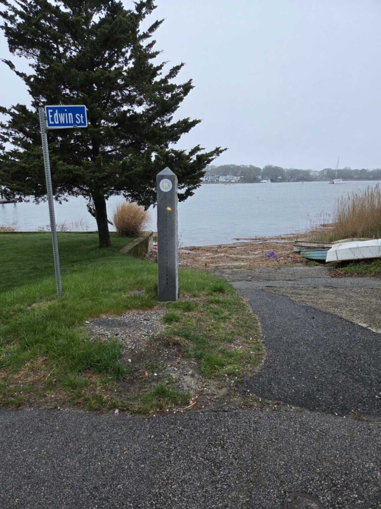 a street sign next to a lake (MyCoast AI)