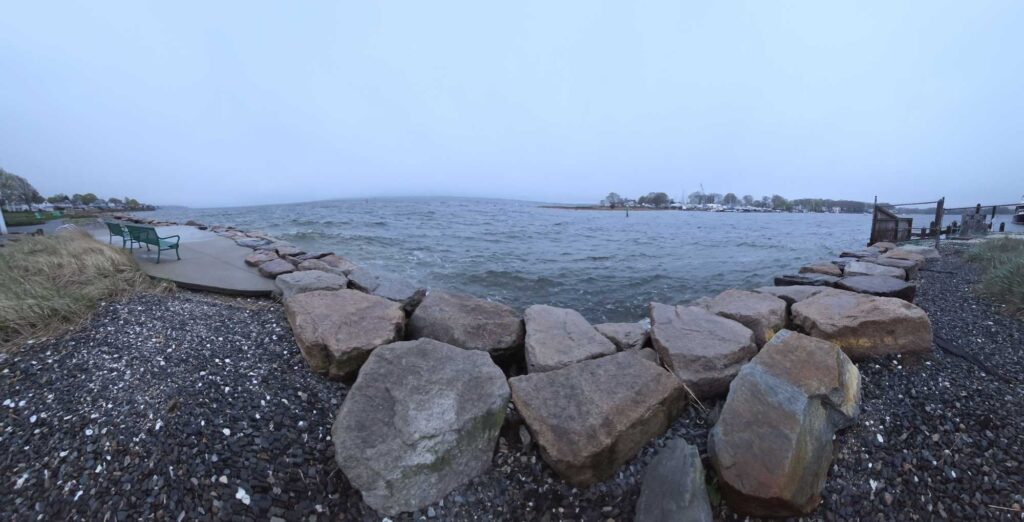 a rocky beach with a dock (MyCoast AI)