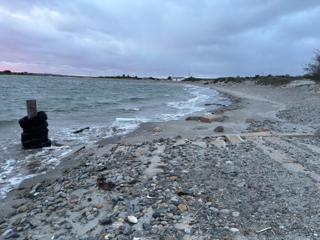 a rocky beach with a pipe (MyCoast AI)