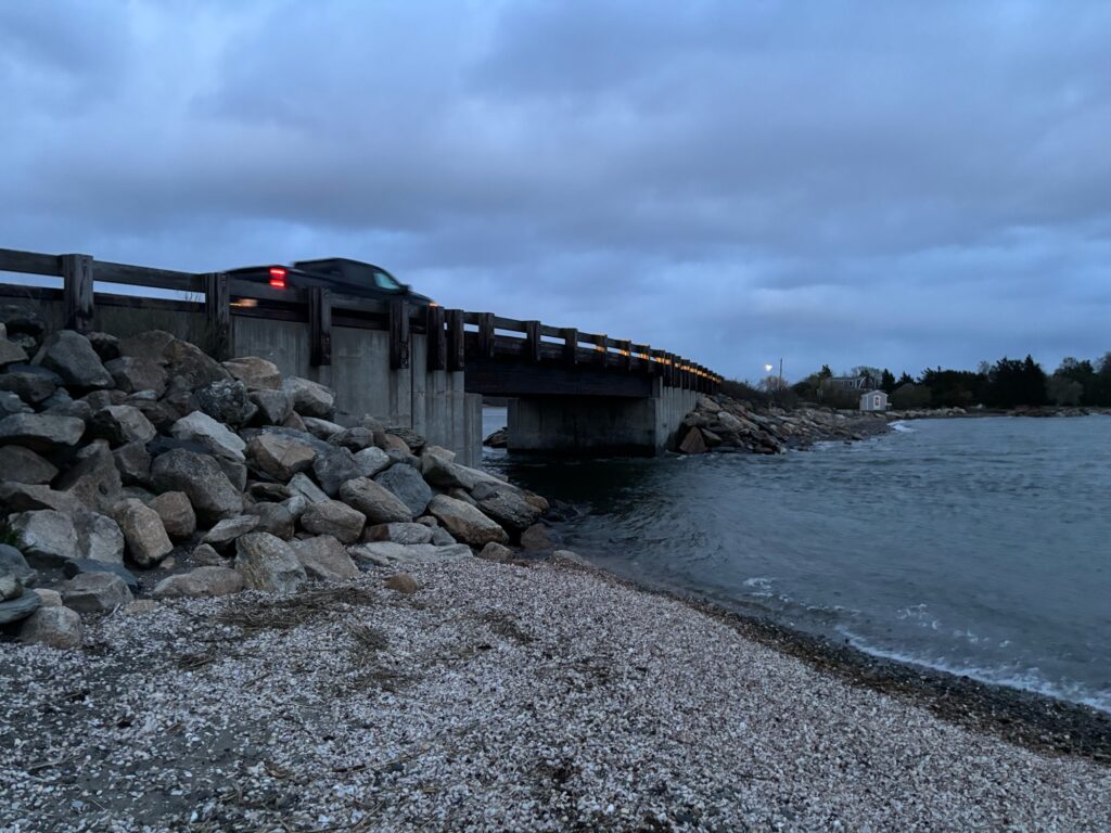 a train on a bridge over a river (MyCoast AI)