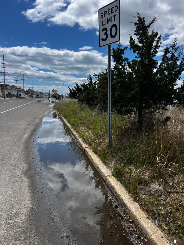 a sign on the side of a road (MyCoast AI)