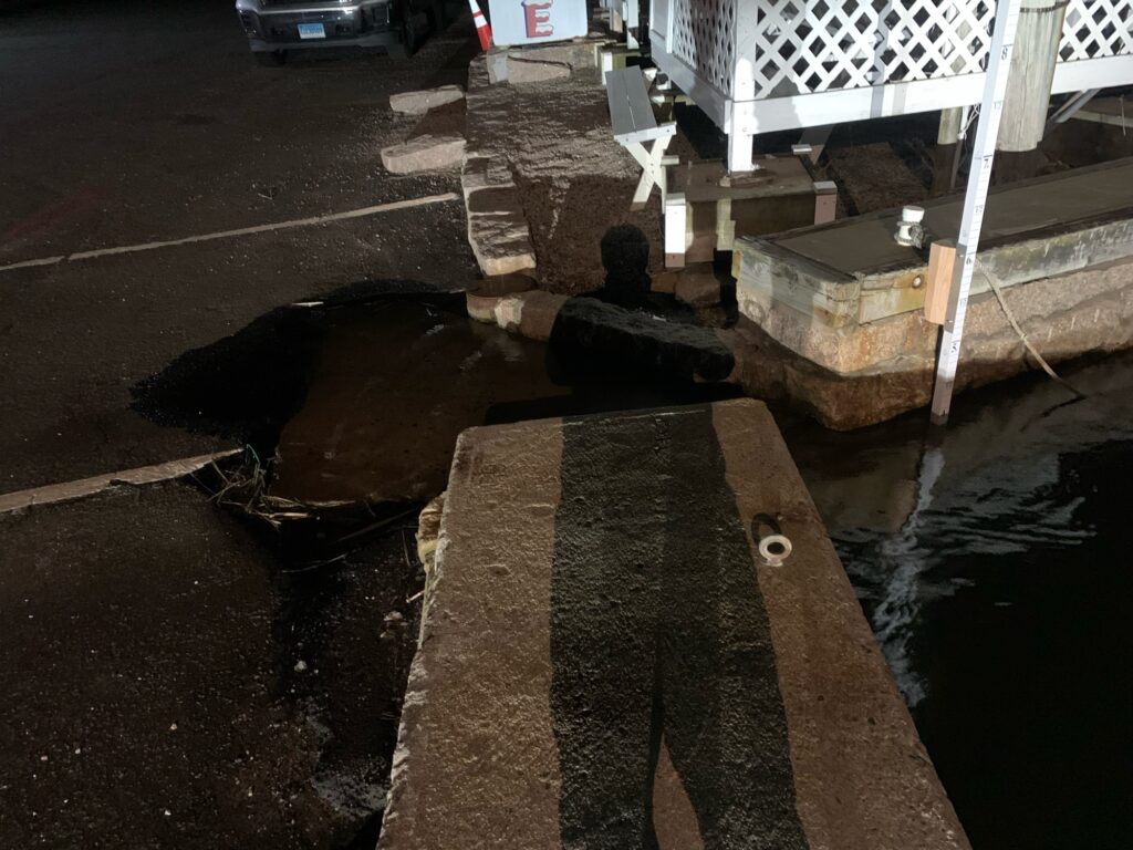 a pile of concrete next to a road (MyCoast AI)