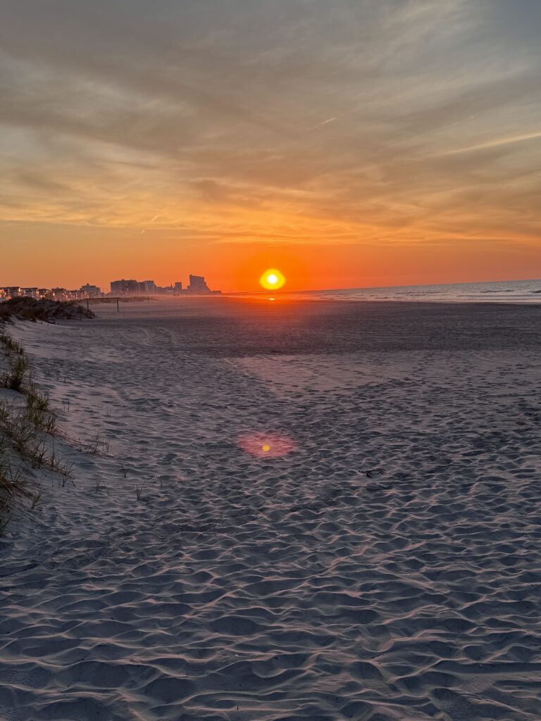 a sunset over a beach (MyCoast AI)