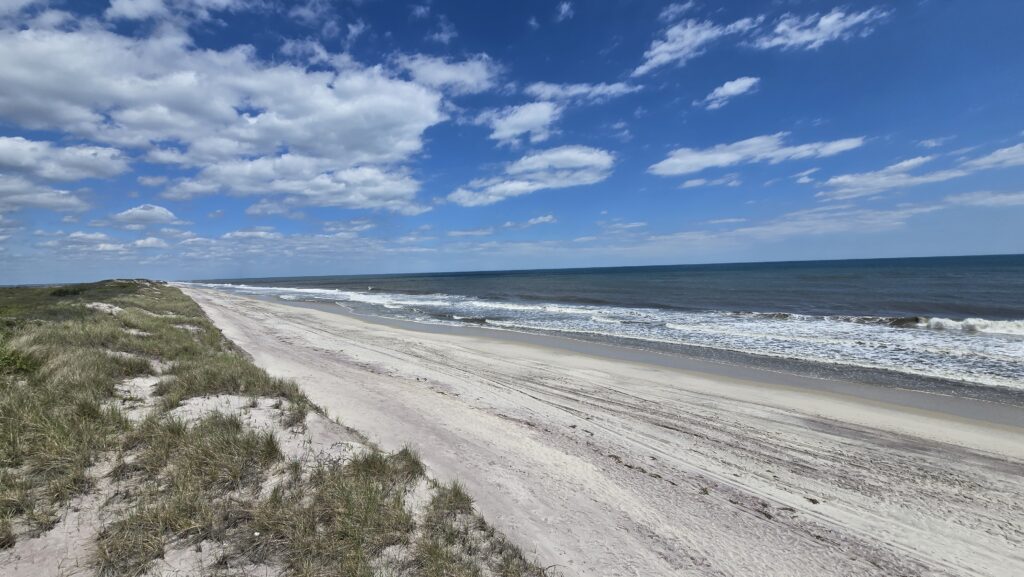 a beach with waves crashing on it (MyCoast AI)