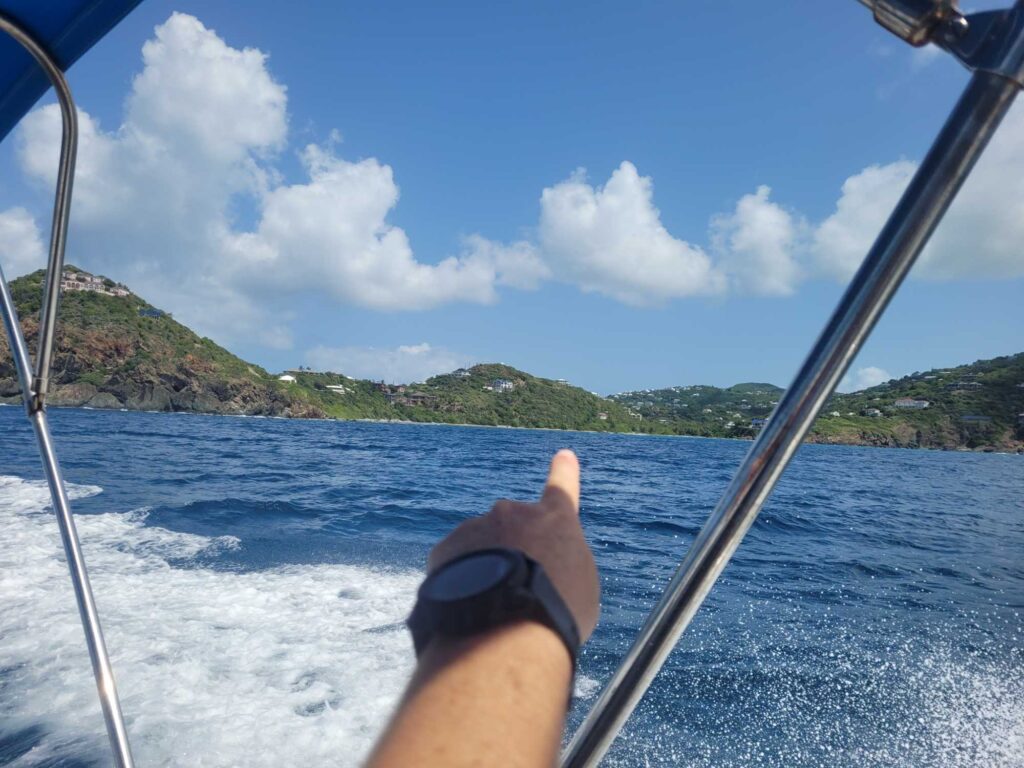 a hand on a boat (MyCoast AI)