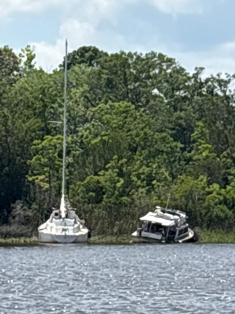 a couple of boats sit in a river (MyCoast AI)