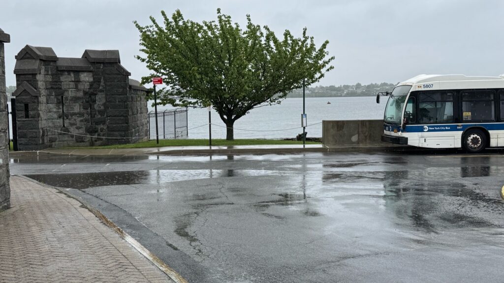 a bus driving through a flooded street (MyCoast AI)