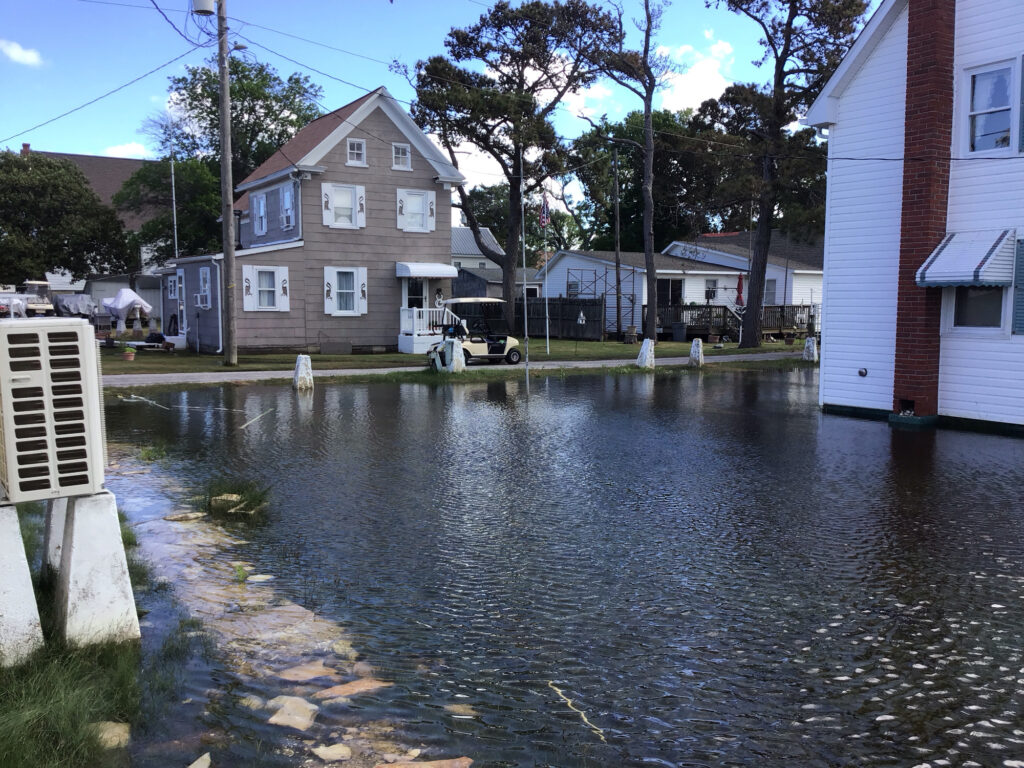 a flooded street with houses (MyCoast AI)