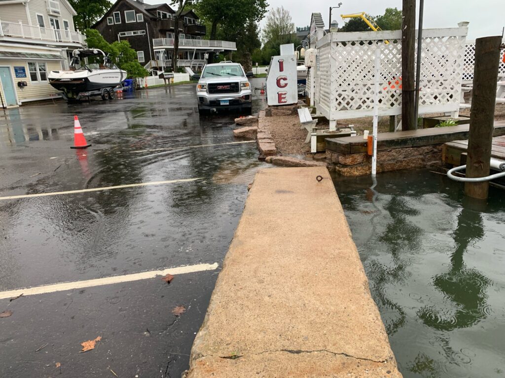 a road with a white car and a white fence and a white truck (MyCoast AI)