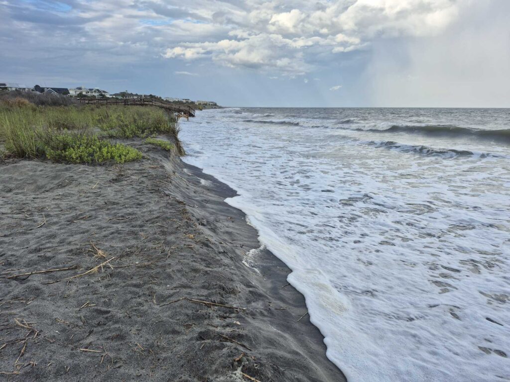 a beach with waves crashing on it (MyCoast AI)