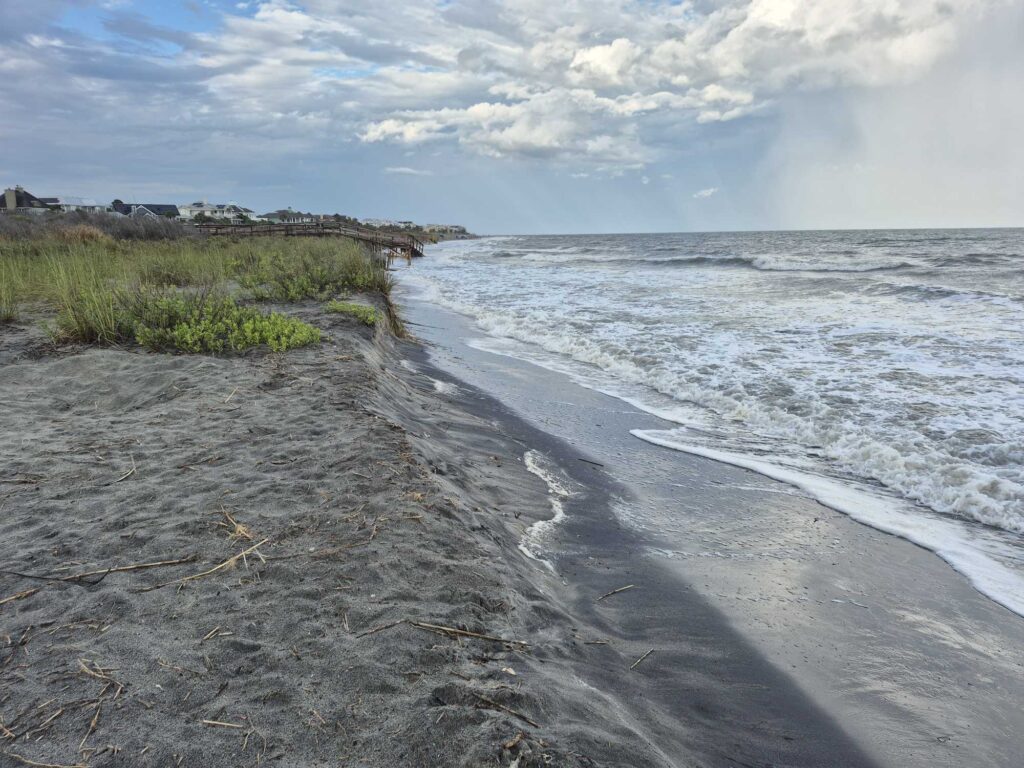 a beach with waves crashing on it (MyCoast AI)