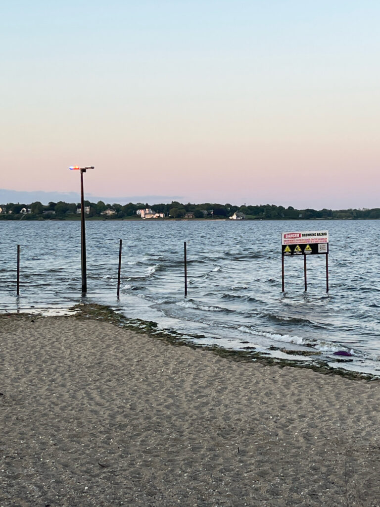 a beach with a sign (MyCoast AI)