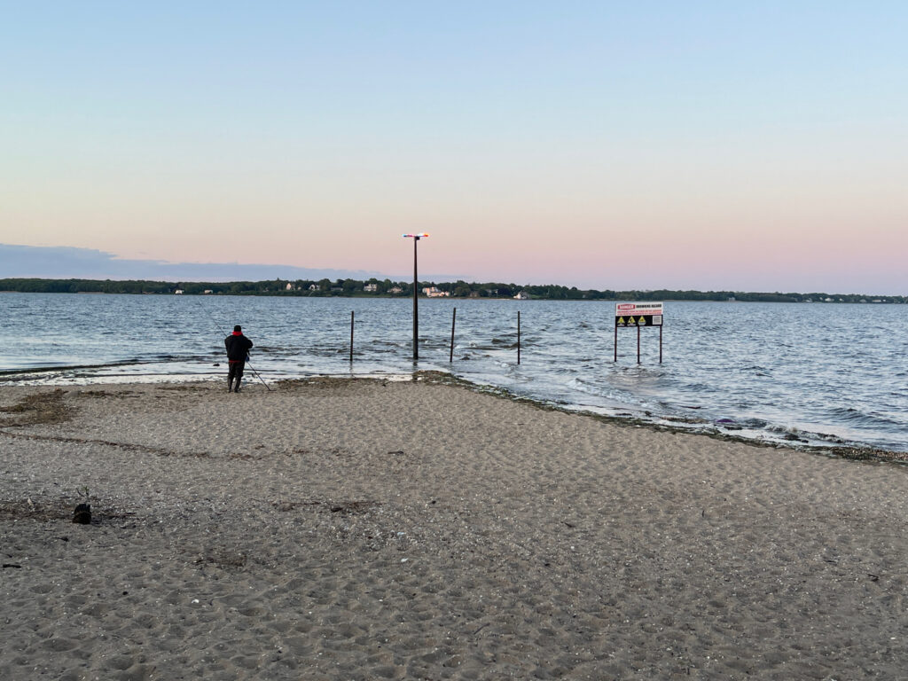 a person standing on a beach (MyCoast AI)