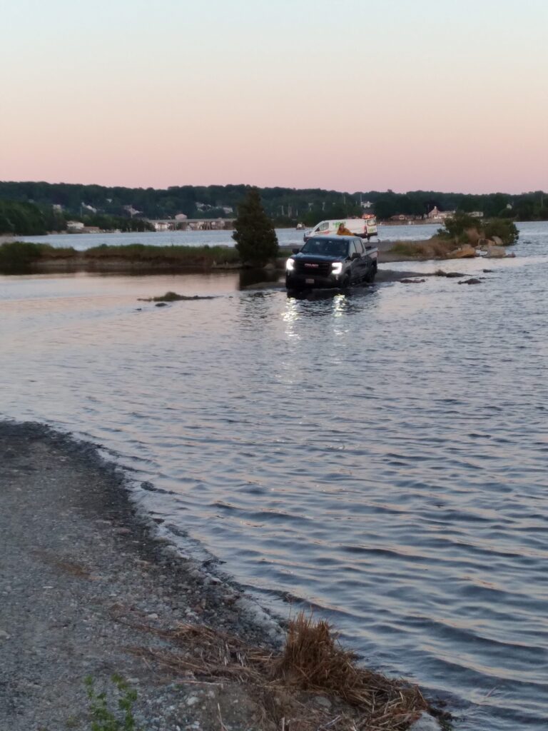 a car driving on a river (MyCoast AI)