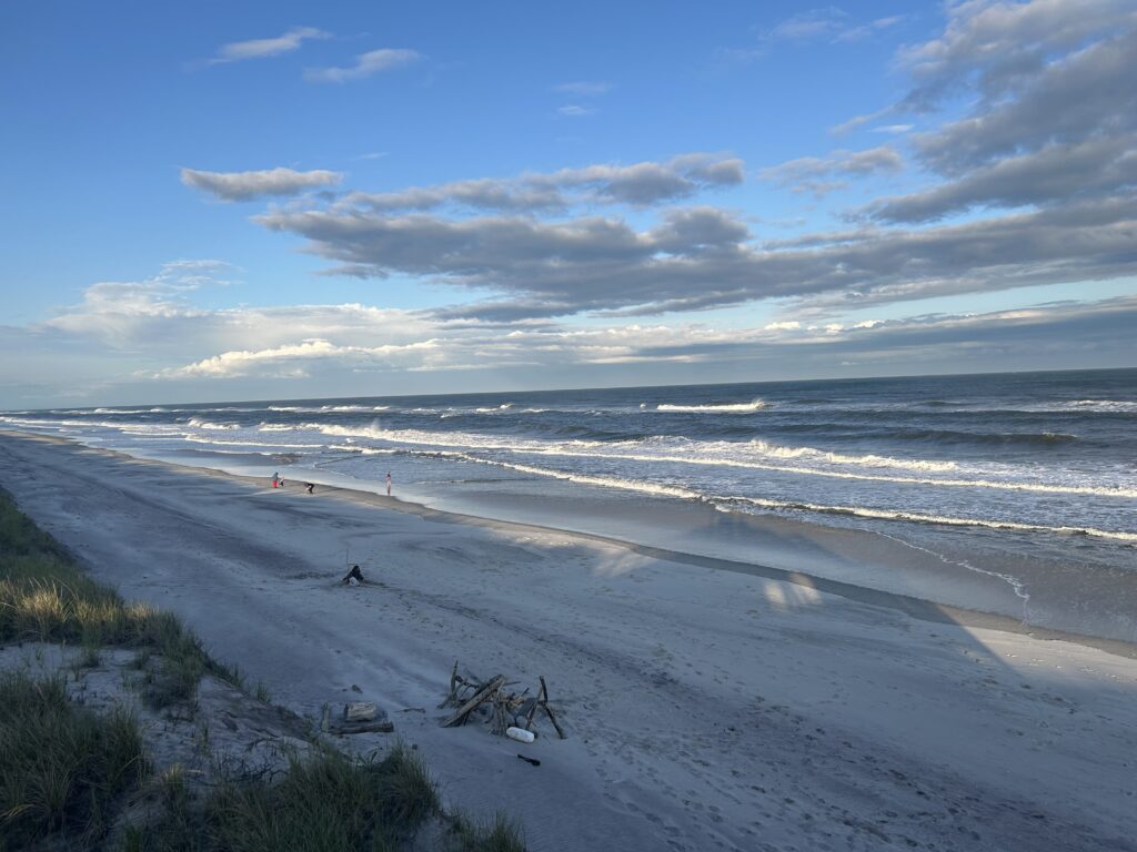 a beach with waves crashing on it (MyCoast AI)