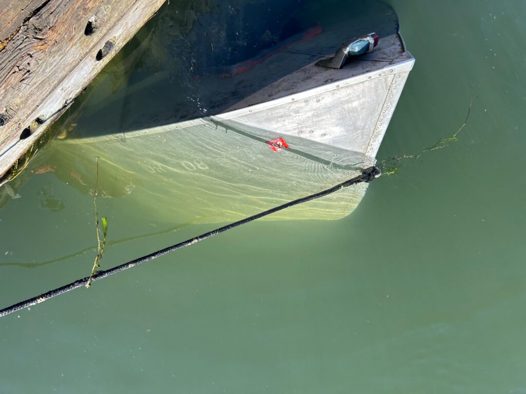 a boat tied to a dock (MyCoast AI)