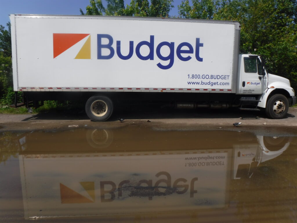 a white truck driving through a flooded road (MyCoast AI)