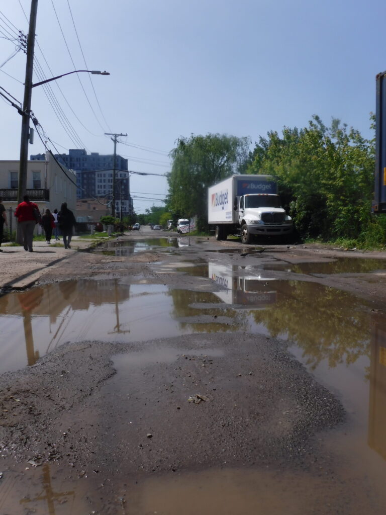 a truck driving through a flooded street (MyCoast AI)